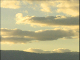 time Lapse Clouds over mountains at sunset