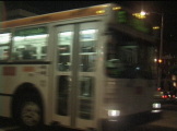 Muni Bus at bus stop at night