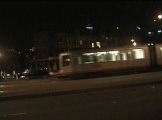 Street Car at bus stop at night