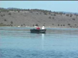 Small boat on mountain lake