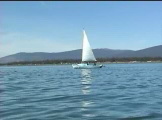 Sail boat on mountain lake