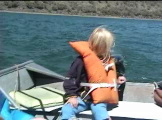 Little girl driving motor boat