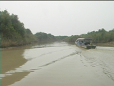 tourist boat going down river in Cambodia