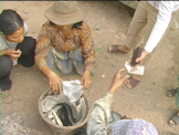 Cambodian woman selling fish in market