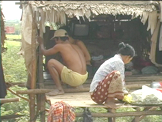 Cambodian family repairing their home