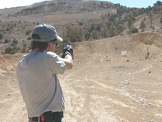 man shooting with pistol