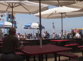 People sitting at beach tables