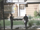 police approaching house at night