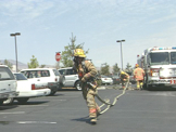 Fire Fighters putting out car fire