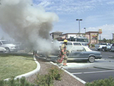 Fire Fighters putting out car fire