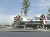 Fire Fighters putting out car fire