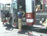 Fire Fighter taking off equipment and close up of gauges