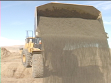 Construction equipment at work truck dumping dirt