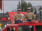 marines riding in car in parade