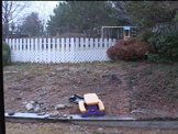 snow falling in backyard