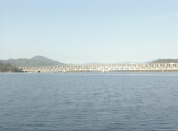 Time lapse of approaching double span brige with train