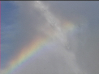 water stream in the air with rainbow